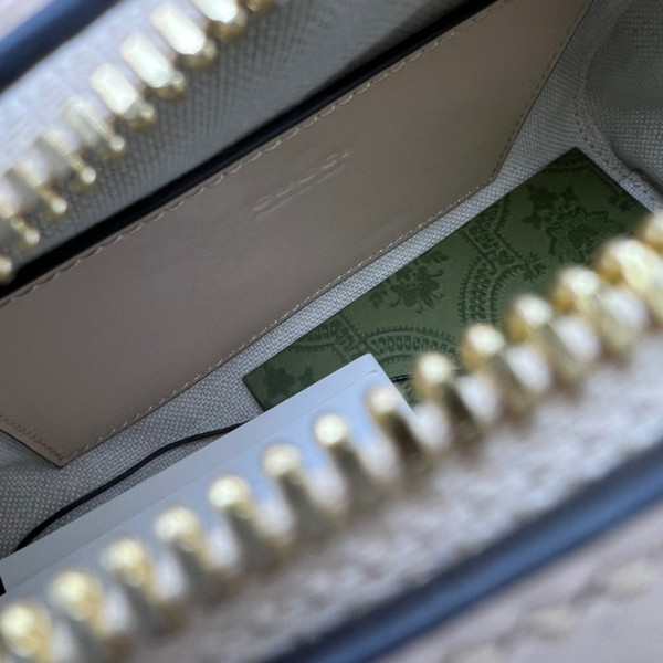 G*u*i gg matelassé leather top handle bag